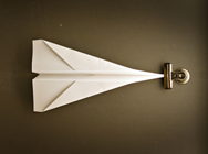 Paper airplane representing our location in downtown Guelph